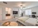 Spacious bedroom with a bed, a desk, a ceiling fan and an ensuite bathroom at 12286 Silvana St, Las Vegas, NV 89141
