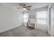 An airy bedroom featuring natural light, a ceiling fan and an adjacent closet at 12286 Silvana St, Las Vegas, NV 89141