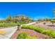 Landscaped community featuring green space, manicured bushes and trees with well-maintained sidewalks and roads at 12286 Silvana St, Las Vegas, NV 89141