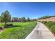 Neighborhood featuring green space, manicured bushes and trees with well-maintained sidewalks and roads at 12286 Silvana St, Las Vegas, NV 89141