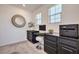 An office space featuring a dark built-in desk and shelving unit at 12286 Silvana St, Las Vegas, NV 89141