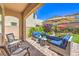 Outdoor patio boasts comfortable seating, brick pavers, and manicured landscaping, perfect for relaxing and entertaining at 12286 Silvana St, Las Vegas, NV 89141