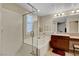 Bright bathroom featuring a soaking tub with tile surround, a shower, and vanity at 1560 Plaza Centre Dr # 103, Las Vegas, NV 89135