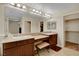 Bright bathroom with double sinks, granite countertops, and a vanity area at 1560 Plaza Centre Dr # 103, Las Vegas, NV 89135
