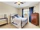 Cozy bedroom with ceiling fan, dresser, and natural light at 1560 Plaza Centre Dr # 103, Las Vegas, NV 89135