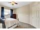Comfortable bedroom with ceiling fan, closet and natural light at 1560 Plaza Centre Dr # 103, Las Vegas, NV 89135