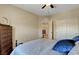Comfortable bedroom with ceiling fan, closet, dresser and natural light at 1560 Plaza Centre Dr # 103, Las Vegas, NV 89135