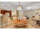 Charming dining area adjacent to a kitchen with bar seating and a comfortable living space at 1560 Plaza Centre Dr # 103, Las Vegas, NV 89135