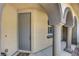 Covered entryway featuring arched columns and a gray front door at 1560 Plaza Centre Dr # 103, Las Vegas, NV 89135