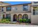 Inviting townhome showcasing well-maintained landscaping and covered entryways at 1560 Plaza Centre Dr # 103, Las Vegas, NV 89135