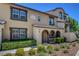Charming townhome features lush landscaping enhancing curb appeal at 1560 Plaza Centre Dr # 103, Las Vegas, NV 89135