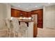 Features dark wood cabinets, stainless steel appliances, and bar stool seating at 1560 Plaza Centre Dr # 103, Las Vegas, NV 89135