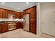 A modern kitchen with sleek stainless steel appliances and dark wood cabinetry at 1560 Plaza Centre Dr # 103, Las Vegas, NV 89135