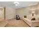 Bright and spacious living area with neutral decor and comfortable seating at 1560 Plaza Centre Dr # 103, Las Vegas, NV 89135