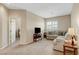 Neutral colored living room featuring a gray couch and a window at 1560 Plaza Centre Dr # 103, Las Vegas, NV 89135