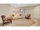 Cozy living area with neutral walls, plush sofa, and stylish accent chairs at 1560 Plaza Centre Dr # 103, Las Vegas, NV 89135