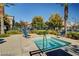 Community spa pool area with deck chairs and lush landscaping at 1560 Plaza Centre Dr # 103, Las Vegas, NV 89135