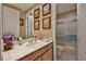 Well-lit bathroom featuring a single sink vanity and a shower-tub combination at 1704 River Birch St, Las Vegas, NV 89117