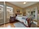 Cozy bedroom with hardwood floors and an access door to the backyard at 1704 River Birch St, Las Vegas, NV 89117