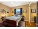 This bedroom boasts hardwood floors, a ceiling fan, and natural light at 1704 River Birch St, Las Vegas, NV 89117