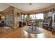 Well-lit dining area with hardwood floors, large windows and a retro jukebox at 1704 River Birch St, Las Vegas, NV 89117