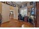 Open game room with hardwood floors, custom furnishings, and French doors at 1704 River Birch St, Las Vegas, NV 89117