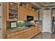 Kitchen features granite countertops, wood cabinets, and a gas cooktop for the home chef at 1704 River Birch St, Las Vegas, NV 89117
