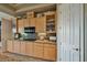 Kitchen with light wood cabinetry, granite countertops, and a view into the dining area at 1704 River Birch St, Las Vegas, NV 89117