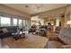 Spacious living room with hardwood floors, large windows, and an open layout at 1704 River Birch St, Las Vegas, NV 89117
