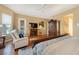 Inviting main bedroom with an armoire, a cozy seating area, and soft lighting at 1704 River Birch St, Las Vegas, NV 89117