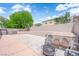 Expansive backyard with a raised patio area, perfect for outdoor seating and relaxation at 1808 Peyton Stewart Ct, North Las Vegas, NV 89086