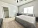 Bright bedroom with a bed, desk, and closet, complemented by a ceiling fan at 1808 Peyton Stewart Ct, North Las Vegas, NV 89086