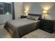 Well-lit bedroom featuring a cozy bed, matching nightstands, and a window for natural light at 1808 Peyton Stewart Ct, North Las Vegas, NV 89086
