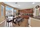 Bright and airy dining area with a table, bench seating, and sliding door access to the patio at 1808 Peyton Stewart Ct, North Las Vegas, NV 89086