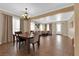 Dining area featuring tile floors, neutral walls, chandelier lighting and view to the adjacent living area at 1808 Peyton Stewart Ct, North Las Vegas, NV 89086
