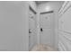 Hallway features a closet and two doors, marked with numbers, against a neutral color scheme at 1808 Peyton Stewart Ct, North Las Vegas, NV 89086