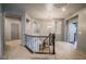Upper level hallway features plush carpeting, decorative wall niches, and a stylish chandelier at 1808 Peyton Stewart Ct, North Las Vegas, NV 89086
