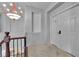 Hallway landing featuring decorative chandelier and three-panel doors for added architectural detail at 1808 Peyton Stewart Ct, North Las Vegas, NV 89086