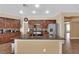 Kitchen featuring stainless steel appliances, ample cabinet space, and a granite-topped island with seating at 1808 Peyton Stewart Ct, North Las Vegas, NV 89086