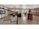 Open-concept living space with stairs to second floor, eat-in dining area, and modern kitchen at 1808 Peyton Stewart Ct, North Las Vegas, NV 89086