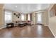 Spacious living room featuring neutral walls, recessed lighting, tile floors, and a beautifully decorated entryway at 1808 Peyton Stewart Ct, North Las Vegas, NV 89086