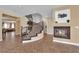 Living area featuring a fireplace and staircase with hardwood flooring at 1808 Peyton Stewart Ct, North Las Vegas, NV 89086