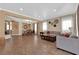 Spacious living room featuring neutral walls, recessed lighting, tile floors, and an adjacent dining area at 1808 Peyton Stewart Ct, North Las Vegas, NV 89086