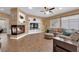 Spacious living room boasting a fireplace, large television, and comfortable seating area with natural light at 1808 Peyton Stewart Ct, North Las Vegas, NV 89086