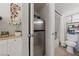 Compact bathroom featuring a toilet, shower with curtain, and a small refrigerator in a convenient layout at 1916 Canosa Ave, Las Vegas, NV 89104