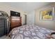Bedroom featuring a ceiling fan, TV, dresser, and comfortable bedding at 1916 Canosa Ave, Las Vegas, NV 89104