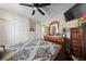 Comfortable bedroom with ceiling fan, mounted television, neutral walls, and built-in closet space at 1916 Canosa Ave, Las Vegas, NV 89104