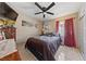 Inviting bedroom featuring a ceiling fan, tiled floors, artwork, and ample natural light at 1916 Canosa Ave, Las Vegas, NV 89104