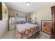 Comfortable bedroom with a neutral color palette, tiled floors, and a bright window at 1916 Canosa Ave, Las Vegas, NV 89104