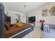 Bright bedroom with a large bed, flat screen TV, and comfortable seating, perfect for relaxation and entertainment at 1916 Canosa Ave, Las Vegas, NV 89104